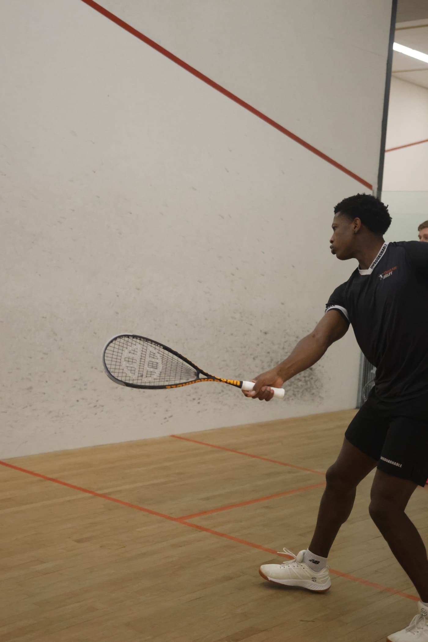 Player in an intense rally while staying composed on court